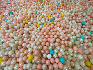 Many colorful plastic balls from above