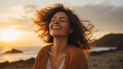Portrait of calm happy smiling free woman with open arms and closed eyes enjoys a beautiful moment life on the seashore at sunset time - obrazy, fototapety, plakaty
