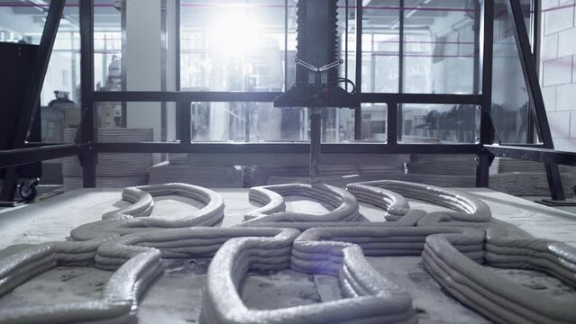 Industrial Construction 3D Printer Working In High Tech Facility. Innovative Real Estate Development Company Printing Building Blocks To A New House With Cement. Advanced Automated Technology Concept.