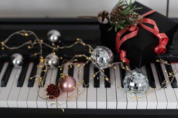 Synthesizer with Christmas decor toys. Christmas music.