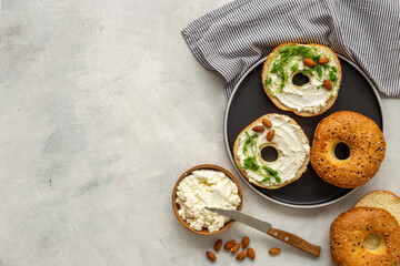 Set of fresh bread bagels with cheese cream. Healthy breakfast background