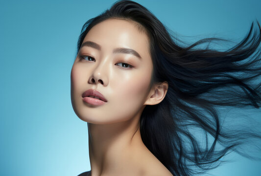 Asian, female and beauty portrait of a woman for skincare, health and cosmetics. Beauty, confident and attractive person with smooth healthy skin routine for glow, dermatology and haircare in studio