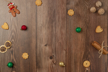 Christmas wood background with cookies, nuts and Christmas decoration