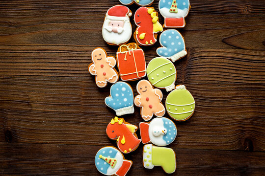 Christmas gingerbread cookies in the shape of a dragons and New Years decoration, top view