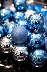 a tray of blue and silver metal ornaments