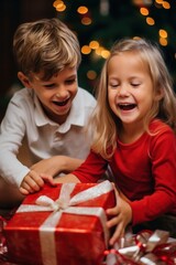 Fototapeta na wymiar A boy and girl share a joyful moment while opening a red christmas gift together