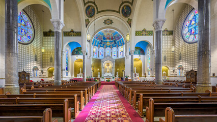 Interior nave and sanctuary of the historic St Benedict Catholic Church in downtown Terre Haute,...