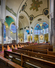 Fototapeta na wymiar Interior nave and sanctuary of the historic St Benedict Catholic Church in downtown Terre Haute, Indiana