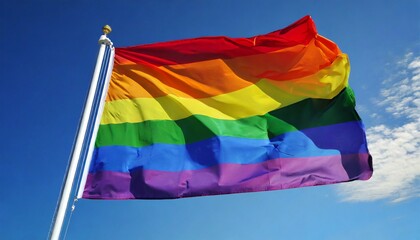 the gay pride rainbow flag waving against clean blue sky close up with clipping path mask alpha channel transparency