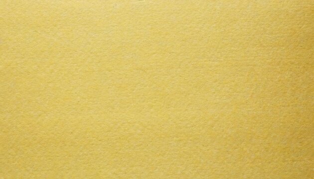 texture of old light yellow paper background closeup structure of dense lemon cardboard