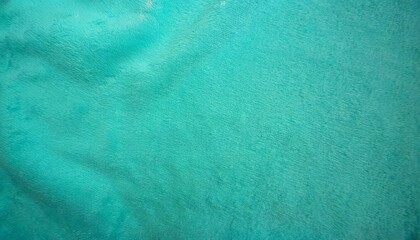 photo of the turquoise background texture soft felt fabric of the color of the sea wave a clean...
