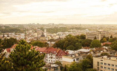 Fototapeta na wymiar Panoramic aerial view of colourful houses in historical old district of Lviv, Ukraine on sunset