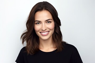 Fototapeta premium close-up portrait of cute beautiful natural brunette woman in black t-shirt, smiling and looking in camera, isolated on white background
