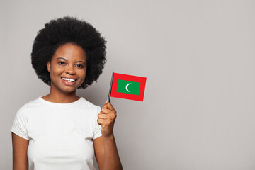 Maldivian woman holding flag of Maldives Education, business, citizenship and patriotism concept