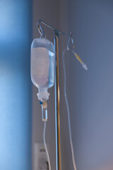 Liquid dropper on blue background in hospital