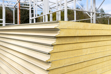 Pile of Insulation Sandwich Panels on a Construction Site - 686227451