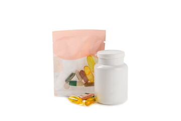 Vitamins and supplements. A variety of vitamin tablets in a jar isolated on a white background. Multivitamin complex for every day. Nutritional supplements. Place for text. Copy space.