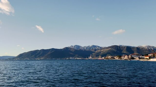 View of Yachts in Porto Montenegro, with mountains in the background. Shot from the Zupa waterfront. 4k
