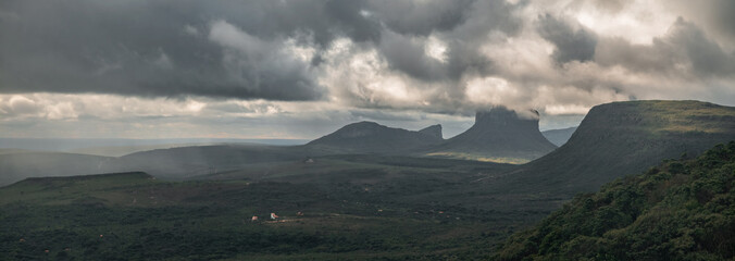 "Chapada Diamantina's stunning view includes local homes and rocky peaks."