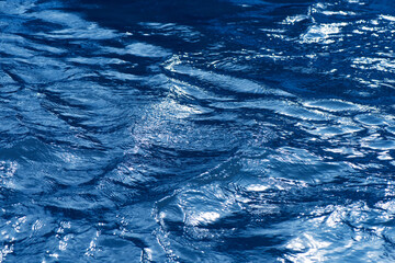Bluewater waves on the surface ripples. Defocus blurred transparent white-black colored clear calm...