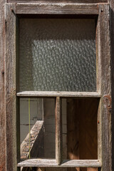 Wooden windows of an old, abandoned house. Ancient Ukrainian architecture