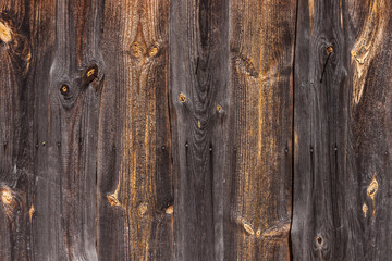 Wooden texture with resinous knots.. The wall of old wooden boards. Close-up, Background