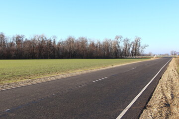 Asphalt road near the field