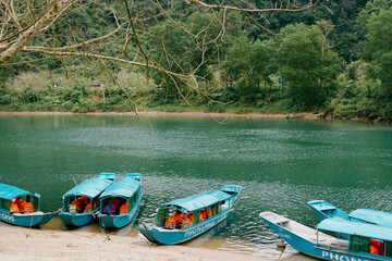 Fototapeta premium Phong Nha traditional blue boats in Vietnam