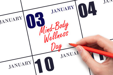 January 3. Hand writing text Mind-Body Wellness Day on calendar date. Save the date.