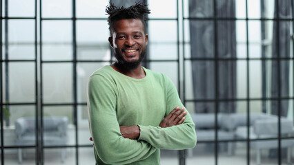 Portrait of a happy African American entrepreneur in office