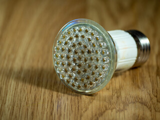 Spot ceiling led lamp on wooden background. Diode lamps for the interior of the house. Modern and...
