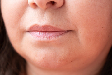 close up part face, lips mature woman 55 years old, wrinkles around mouth, age-related skin...