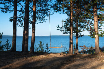 swing in the woods by the lake. Kandalaksha, Murmansk region