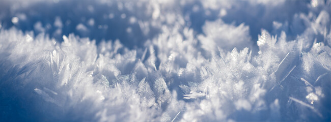 Snow flake panorama with macro ice formations – crystalline structures of frozen water after a...