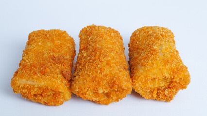 Spicy chicken risoles stuffed with chicken and chili and enclosed in crape-like wrappers and rolled into bread crumbs and fried. isolated on white background.