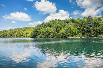 View of the beautiful clear blue Plitvice Lakes and picturesque waterfalls. Rocks and green trees around lakes with blue water. Breathtaking view in the Plitvice Lakes National Park .Croatia
