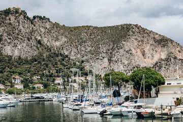 Fototapeta na wymiar Beaulieu sur Mer, France - July 30, 2023: Picturesque port with yachts in Beaulieu sur Mer, in the south of France