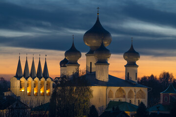 Belfry and domes of the Assumption Cathedral of the Tikhvinsky Assumption Monastery on a cloudy...