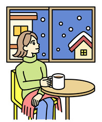 A young woman sitting on a chair and looking at the snow from her window