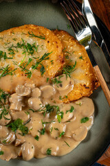 Crispy potato pancakes with mushroom sauce