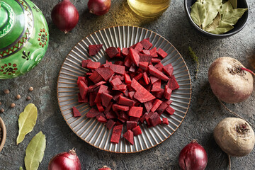 Chopped red beet with spices - praparation of fermented kvass - obrazy, fototapety, plakaty