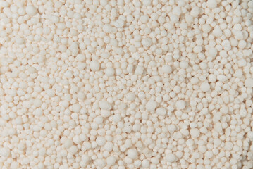 Granulated mineral fertilizers on a dark background