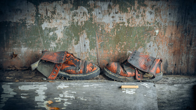 old forgotten torn red shoes