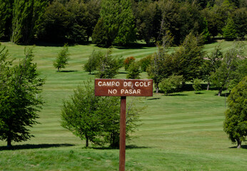 rustic wooden sign with the legend 