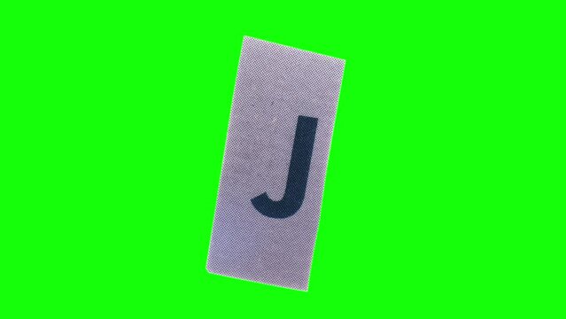 Lowercase J Letter in Paper Cut Letter. Ransom Letter style. Magazine Cut Outs. Wiggle loop.