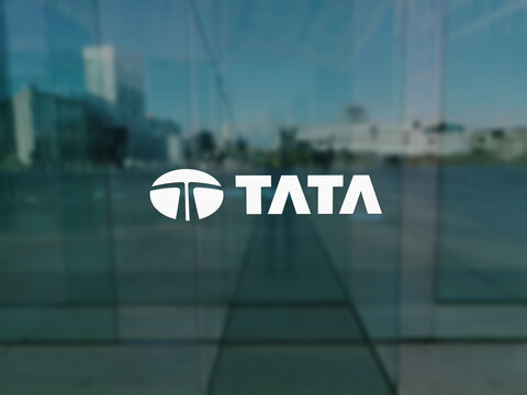 Tata logo on the window of a building in a business district.