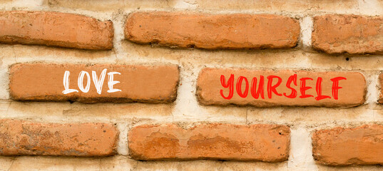 Fototapeta na wymiar Love yourself symbol. Concept words Love yourself on beautiful brown brick wall. Beautiful brown brick wall background. Psychology love yourself concept. Copy space.