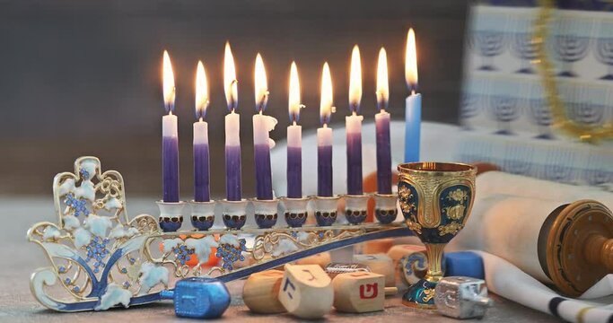 With Hanukkiah menorah burning candles Hanukkah is traditional religious symbol of Jewish holiday Hanukkah