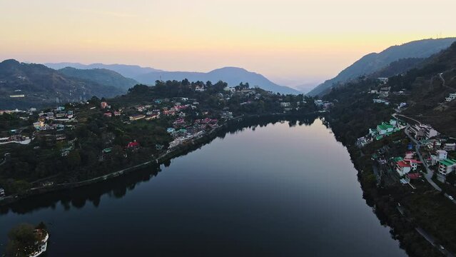 Aerial view of Bhimtal lake in Nainital, Uttarakhand. Drone view of a beautiful lake situated amidst hills of Himalayas. Sunset view of a Bhimtal lake in Kumaon, India. Lake views in the mountains. 
