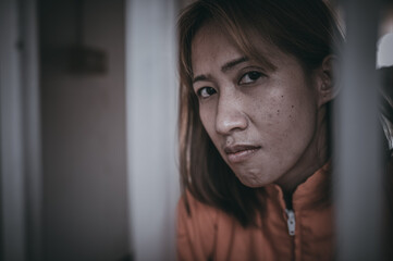 Hands of women desperate to catch the iron prison,prisoner concept,thailand people,Hope to be...